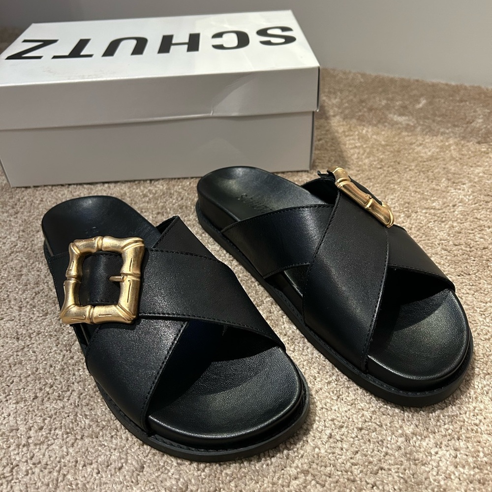 SCHUTZ Enola Crossed Black Sandals with Gold Accent
 Size 7B